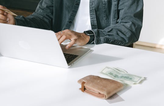 a freelancer budgeting their expenses on a laptop