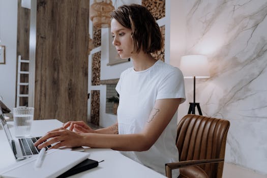 a freelancer organizing expenses on a laptop