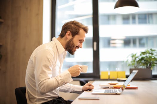 freelancer enjoying a cup of coffee while reviewing finances