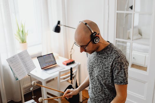 musician working on a laptop